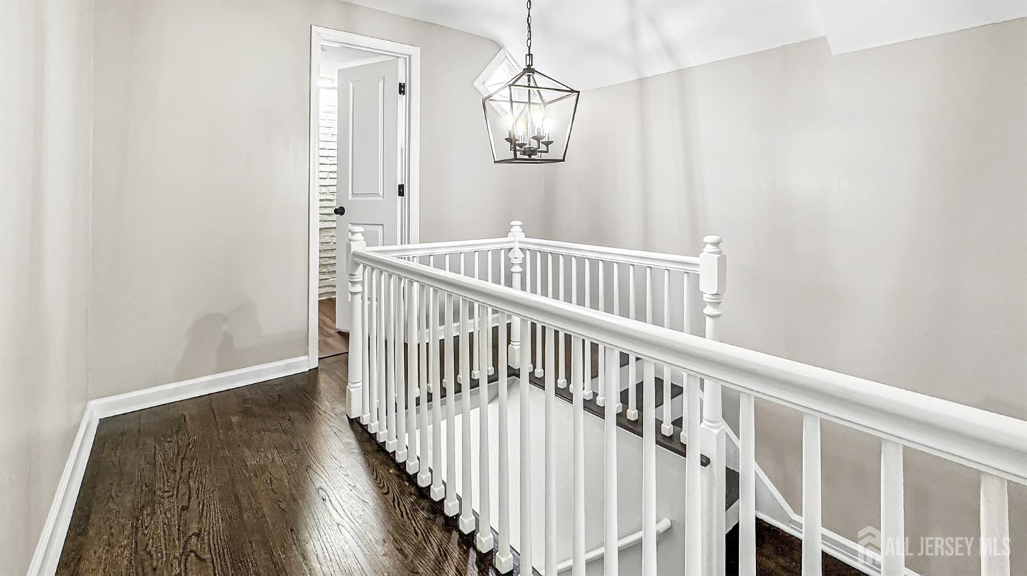 3 Brady Drive Gladstone, NJ 07934 - Photo 18 of 34 a view of a hallway with wooden floor and windows