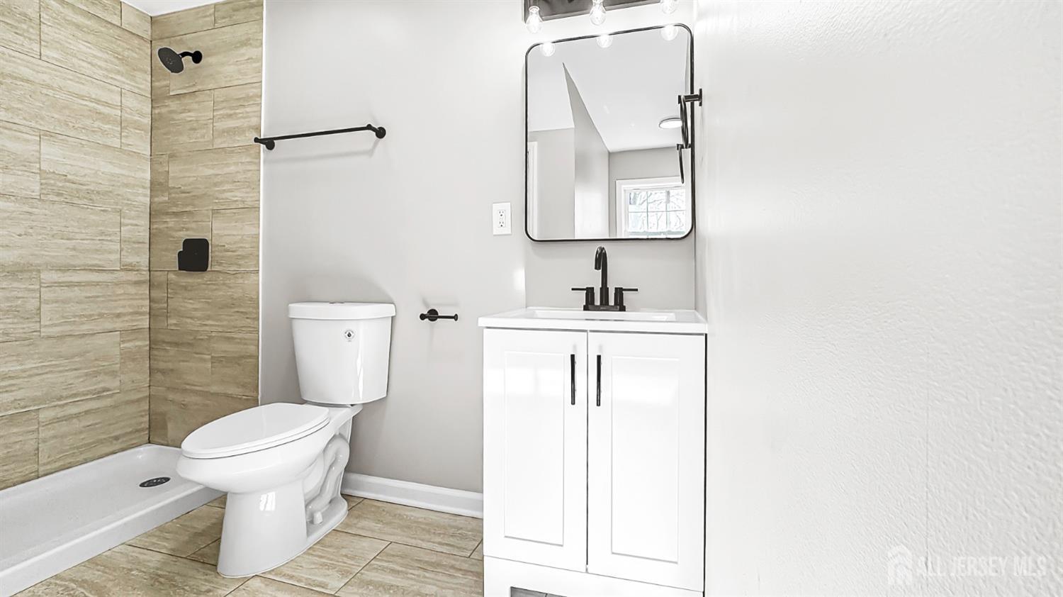 3 Brady Drive Gladstone, NJ 07934 - Photo 20 of 34 a bathroom with a toilet a sink and mirror