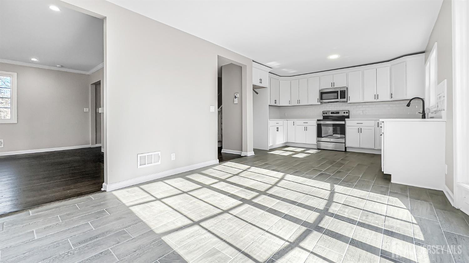 3 Brady Drive Gladstone, NJ 07934 - Photo 7 of 34 a kitchen with stainless steel appliances a refrigerator and a stove top oven