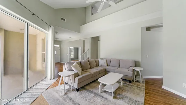 a living room with furniture and a rug