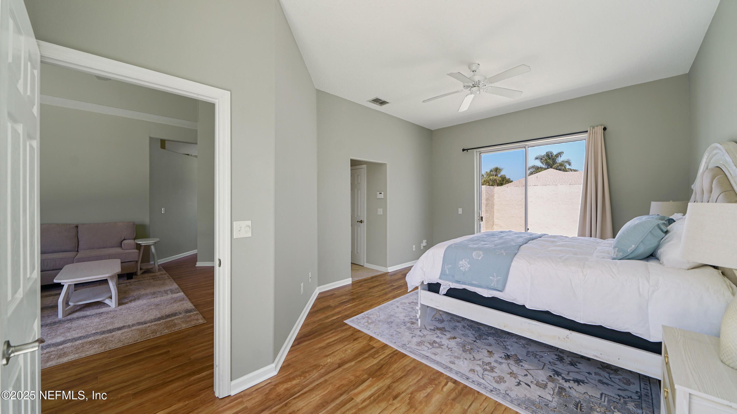 165 Cedar Ridge Circle St. Augustine, FL 32080 - Photo 17 of 46 a bedroom with a bed and a chandelier