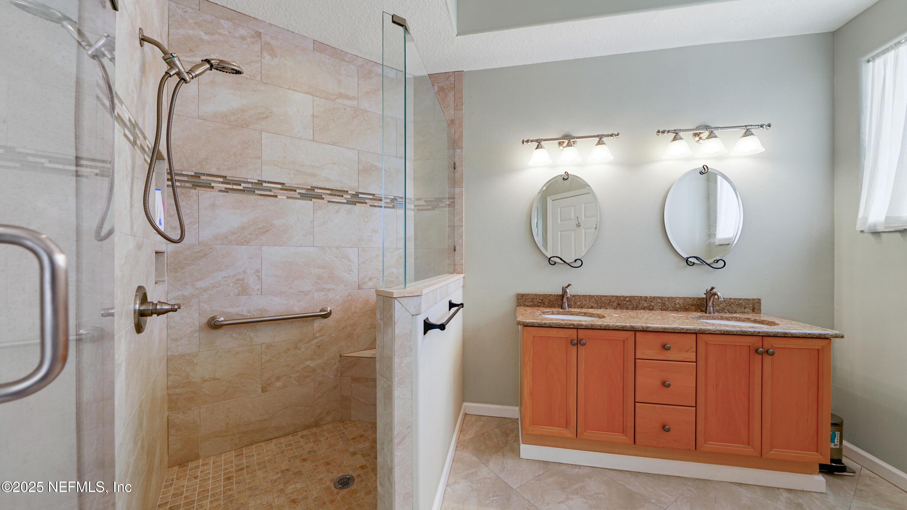 165 Cedar Ridge Circle St. Augustine, FL 32080 - Photo 18 of 46 a bathroom with a double vanity sink mirror and shower
