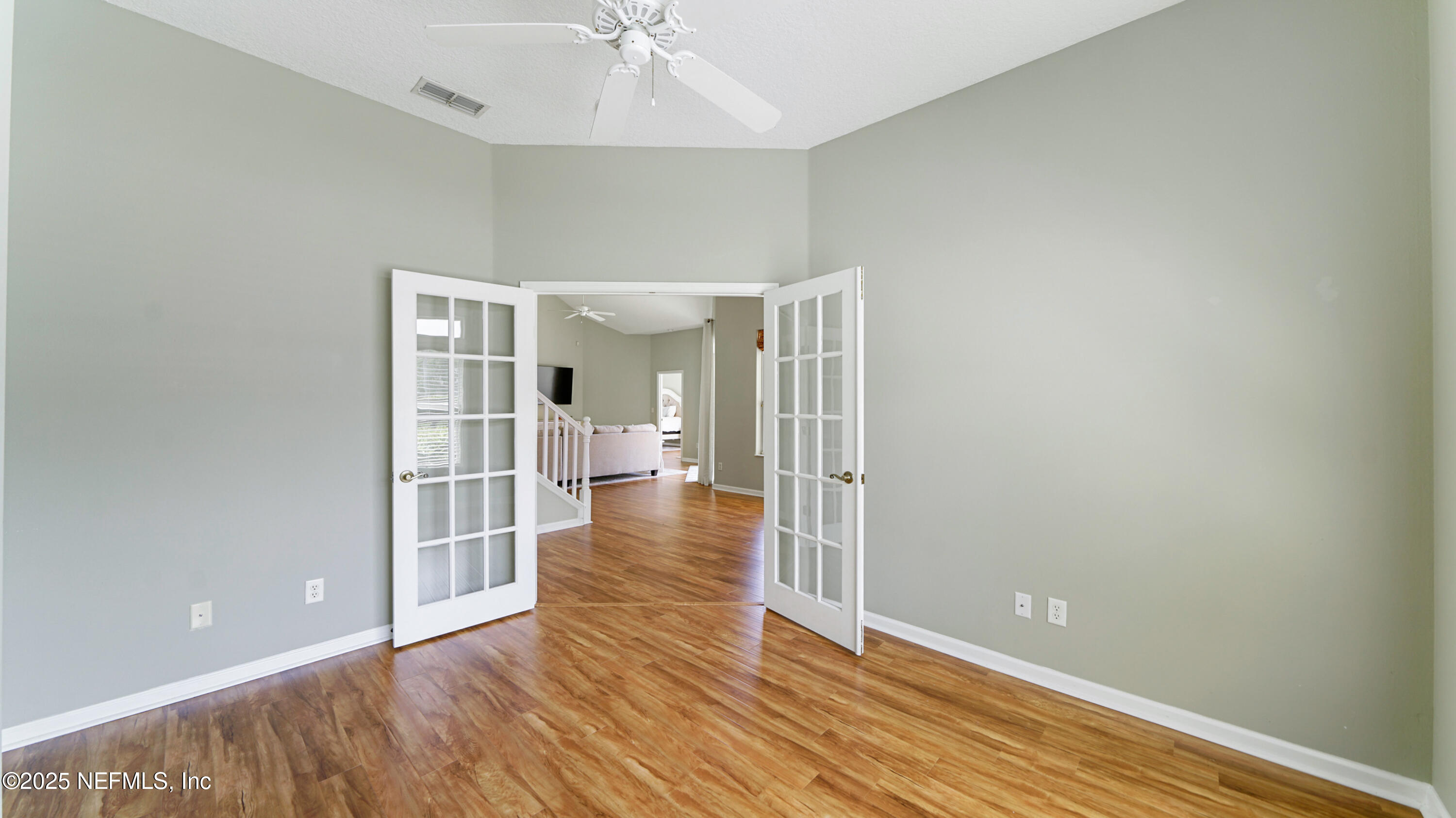 165 Cedar Ridge Circle St. Augustine, FL 32080 - Photo 6 of 46 wooden floor in an empty room with a window
