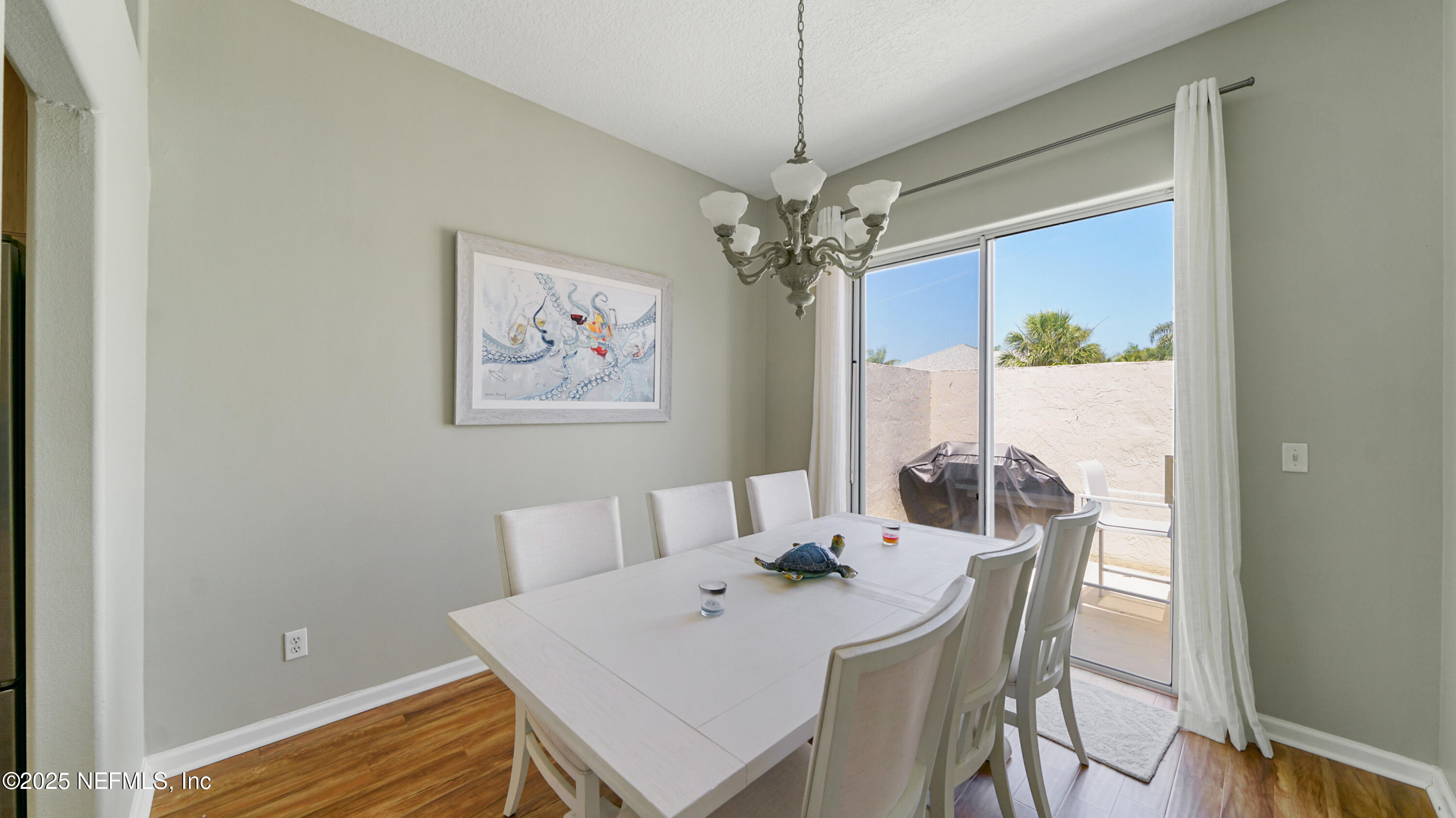 165 Cedar Ridge Circle St. Augustine, FL 32080 - Photo 10 of 46 a view of a dining room with furniture window and wooden floor
