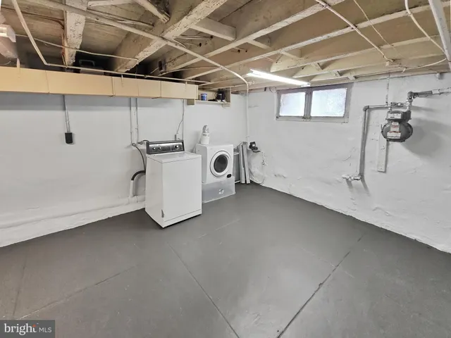 a view of a storage & utility room with a sink