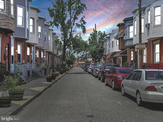 a view of a couch in the middle of a street