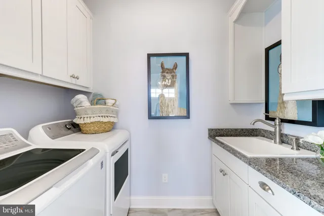 a bedroom with two beds and a large window