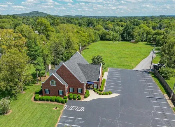 a aerial view of a house with a yard