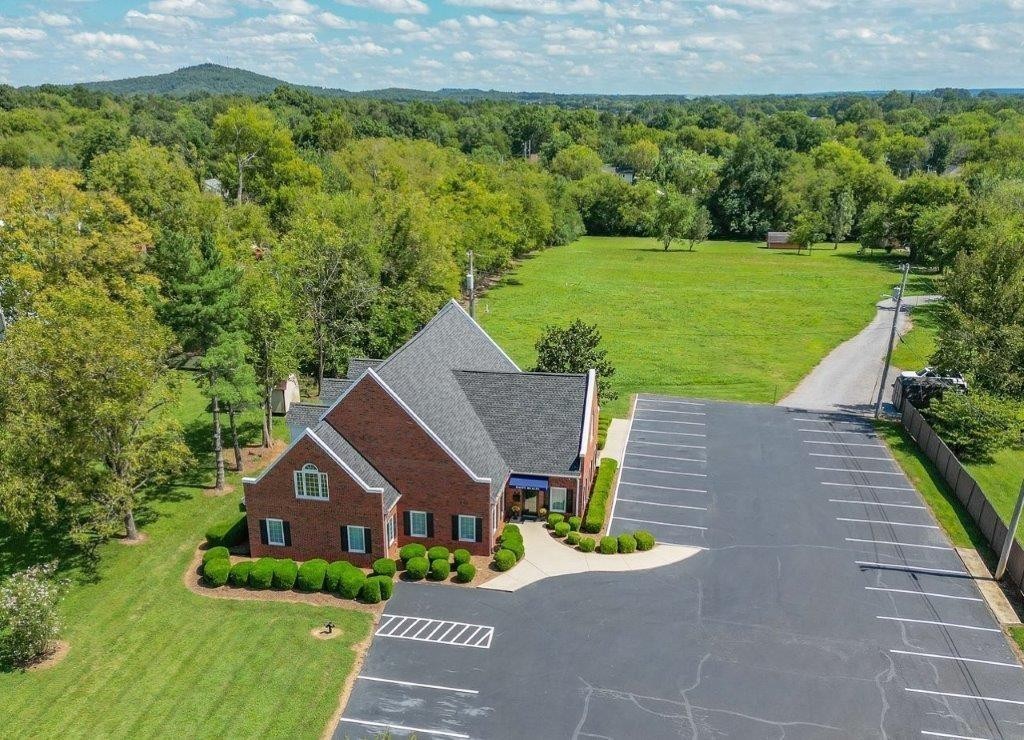1404 North Main Street Shelbyville, TN 37160 - Photo 2 of 27 a aerial view of a house with a yard