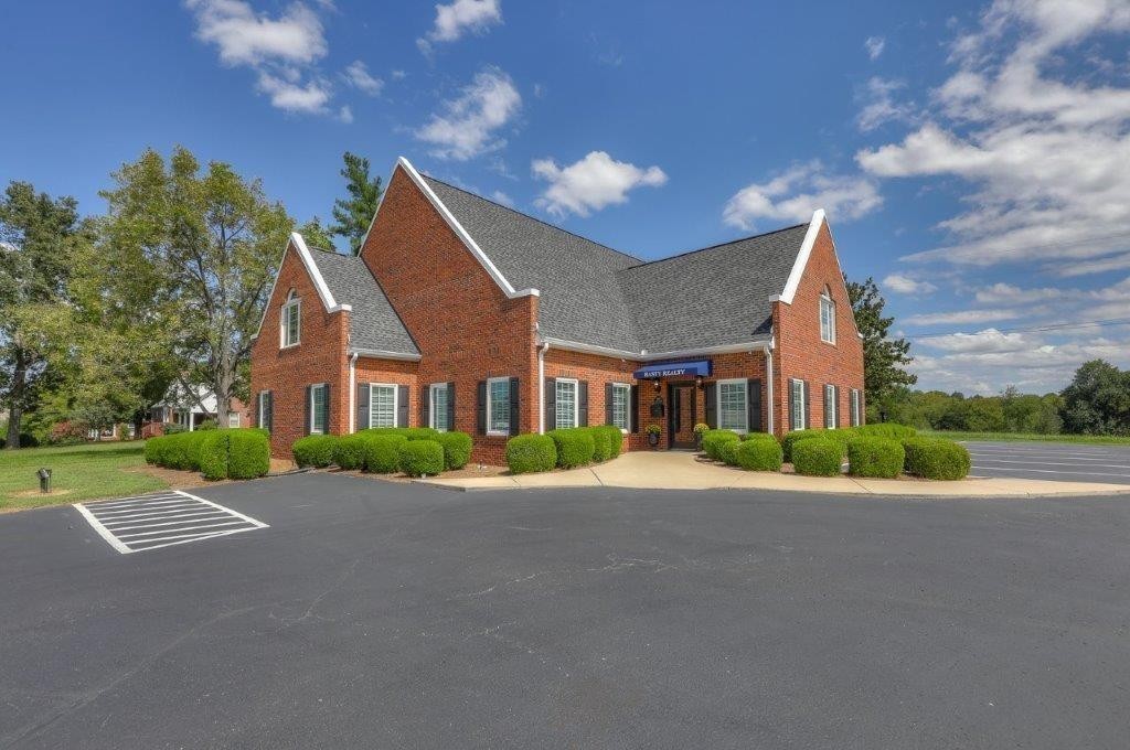 1404 North Main Street Shelbyville, TN 37160 - Photo 3 of 27 a view of a house with a big yard plants and trees
