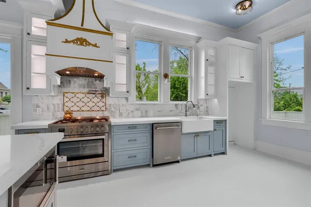 a kitchen with a sink and a refrigerator