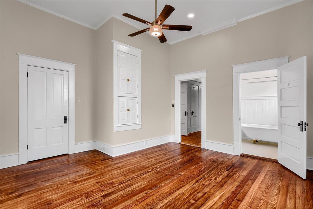 511 South Travis Street Sherman, TX 75090 - Photo 19 of 40 a view of empty room with wooden floor
