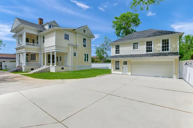 a view of a hallway to a livingroom with furniture