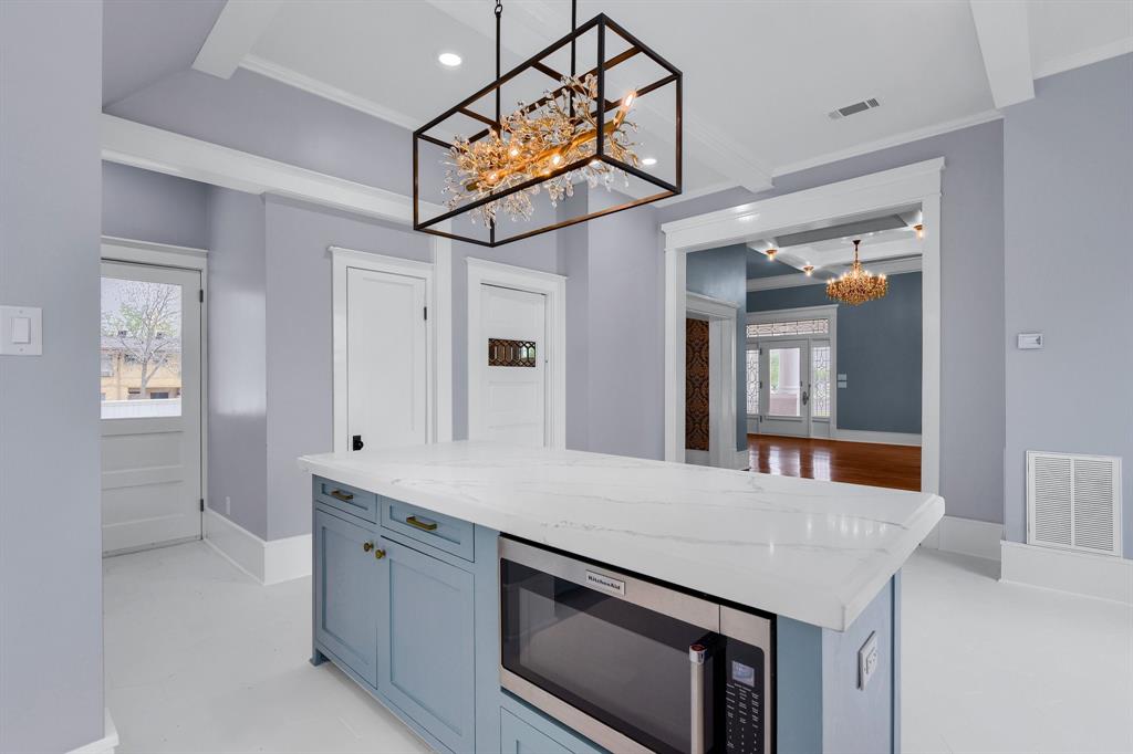 511 South Travis Street Sherman, TX 75090 - Photo 7 of 40 a kitchen with a sink and a refrigerator