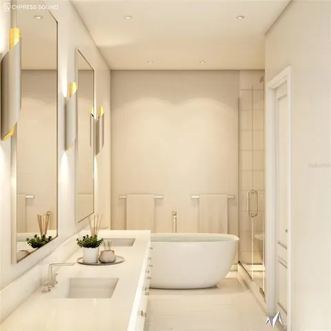 a living room with a large window and a white table