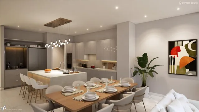 a dining room with furniture and a chandelier