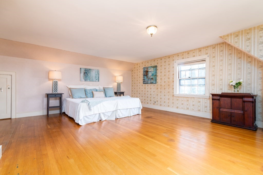 23 Appleton Avenue Beverly, MA 01915 - Photo 18 of 34 a spacious bedroom with a bed and a dresser