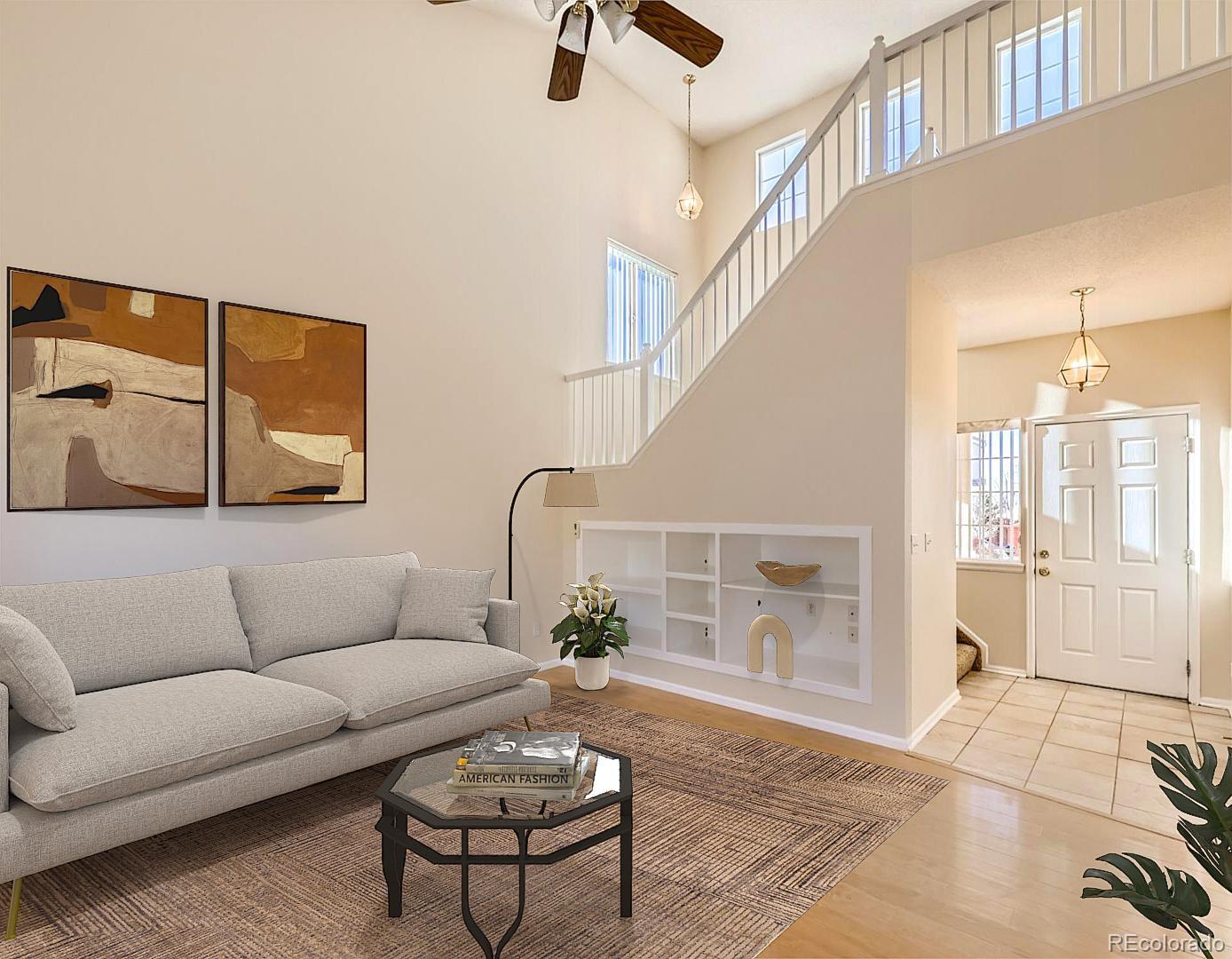 422 Chambers Way Aurora, CO 80011 - Photo 13 of 44 a living room with furniture and wooden floor