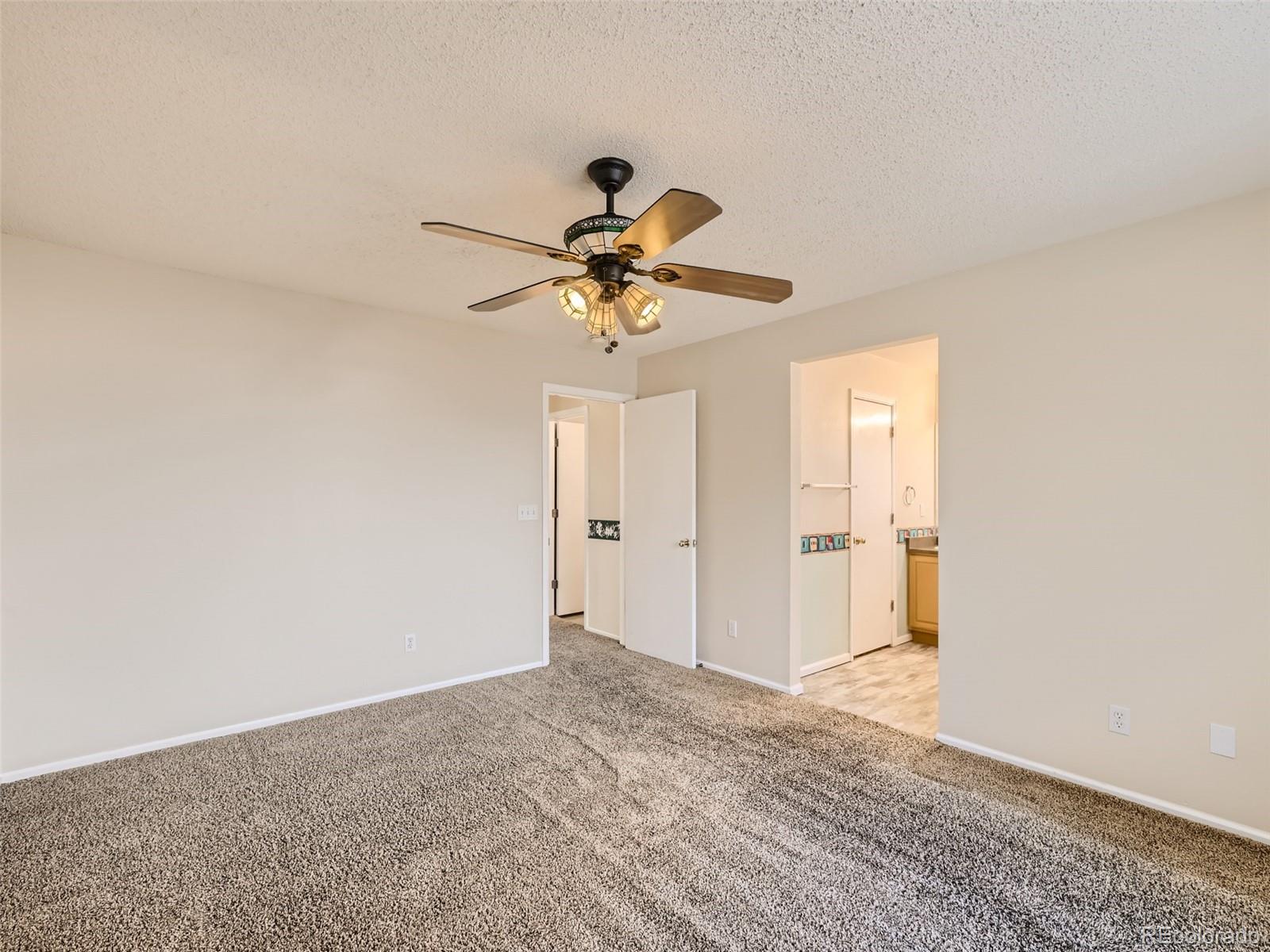 422 Chambers Way Aurora, CO 80011 - Photo 25 of 44 a view of a chandelier fan in a room