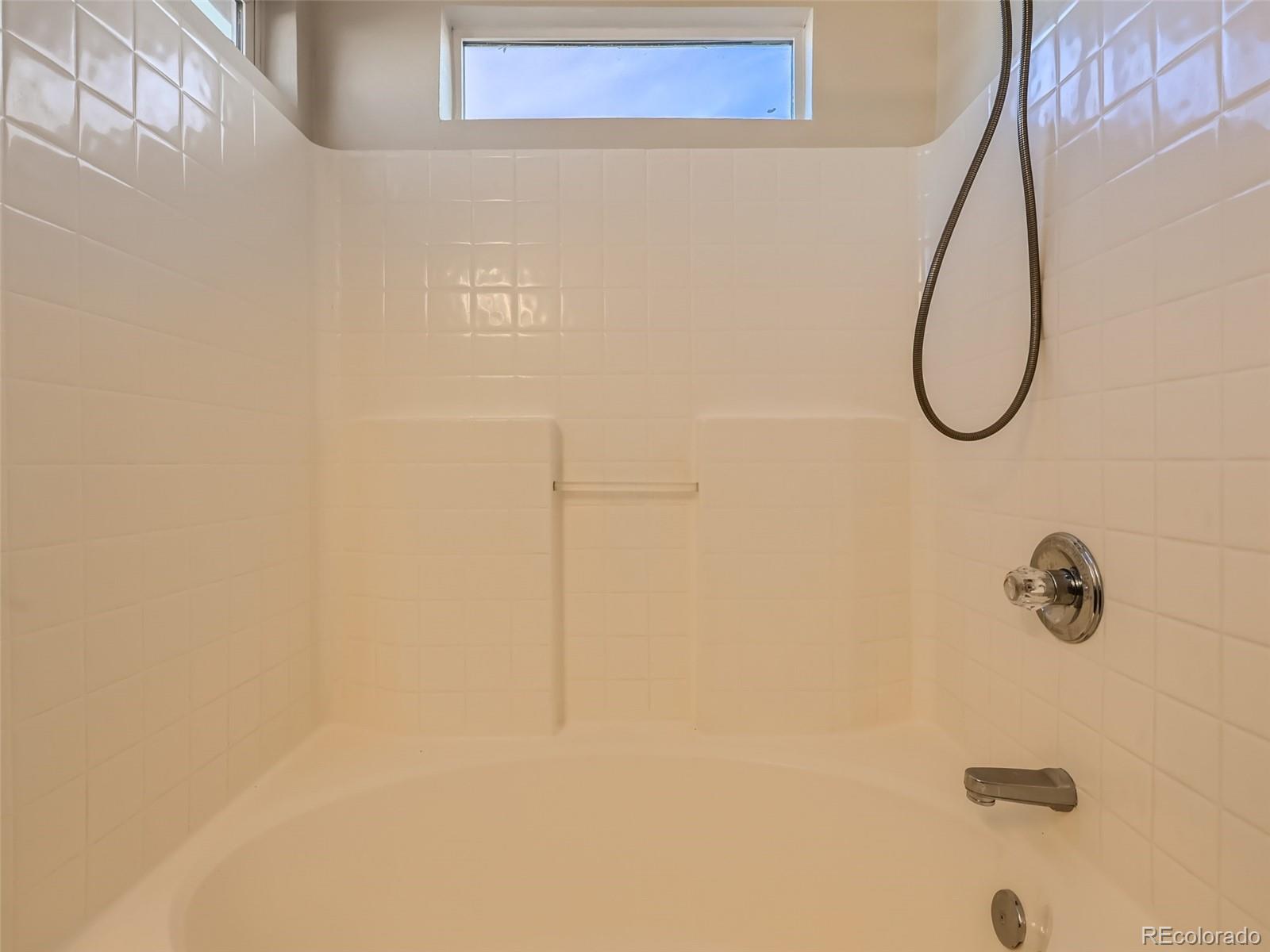 422 Chambers Way Aurora, CO 80011 - Photo 30 of 44 a bathroom with a shower