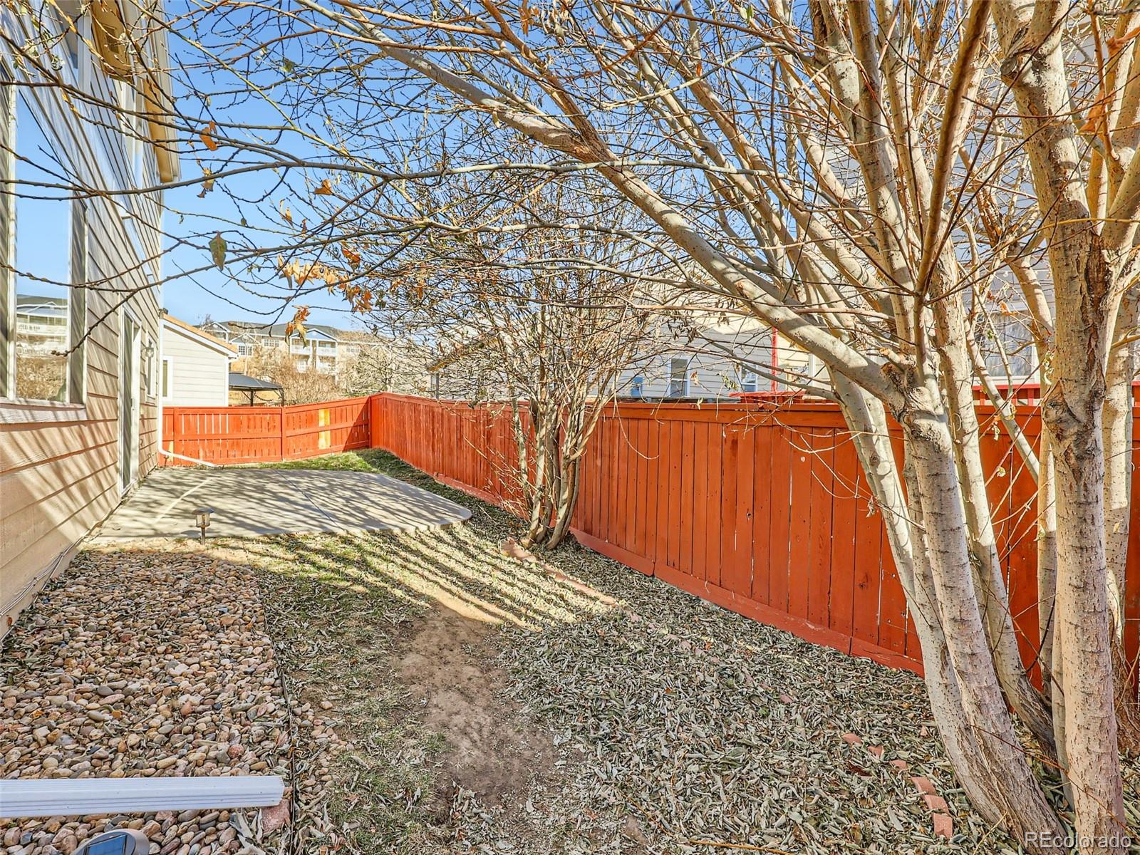 422 Chambers Way Aurora, CO 80011 - Photo 41 of 44 a view of a backyard of the house
