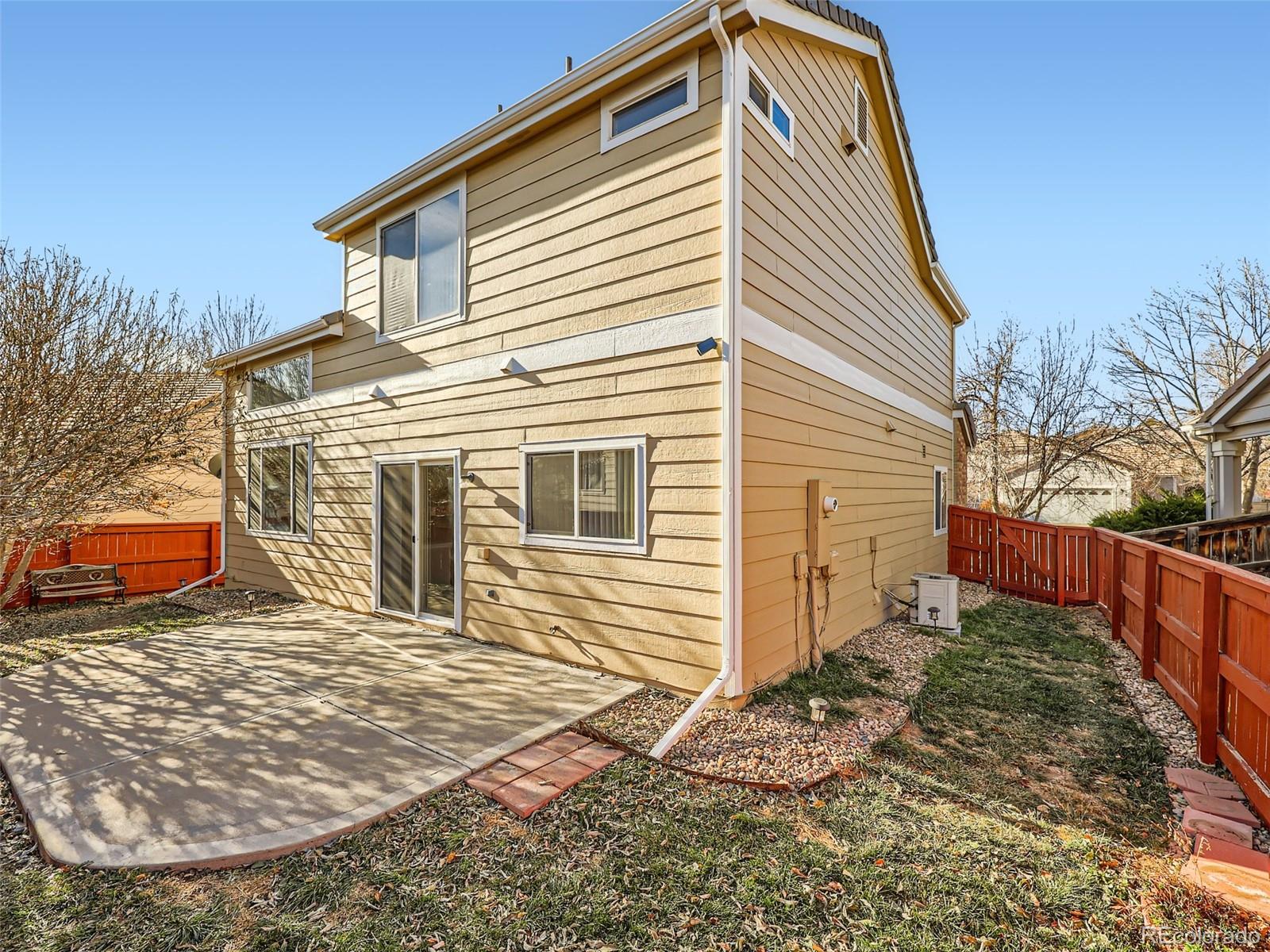422 Chambers Way Aurora, CO 80011 - Photo 42 of 44 a front view of a house with a yard