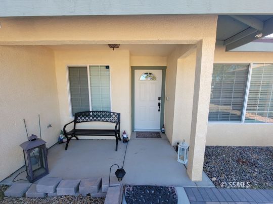 1113 West Iowa Avenue Ridgecrest, CA 93555 - Photo 2 of 21 a living room with furniture and a window