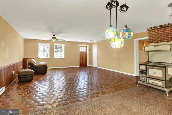 a view of a livingroom with furniture and windows