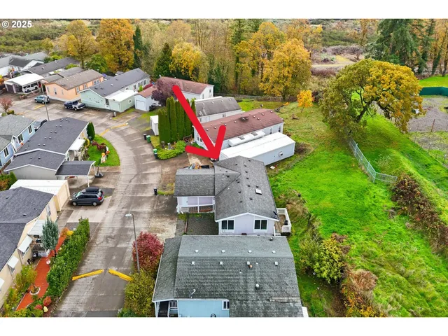 an aerial view of a house with a garden