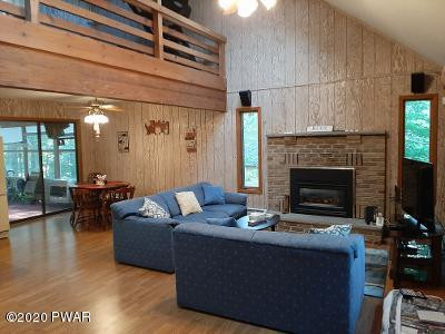 409 Northgate Road Lake Ariel, PA 18436 - Photo 31 of 31 a living room with furniture and a fireplace