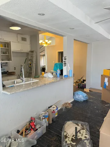 a view of a room with wooden floor and fan