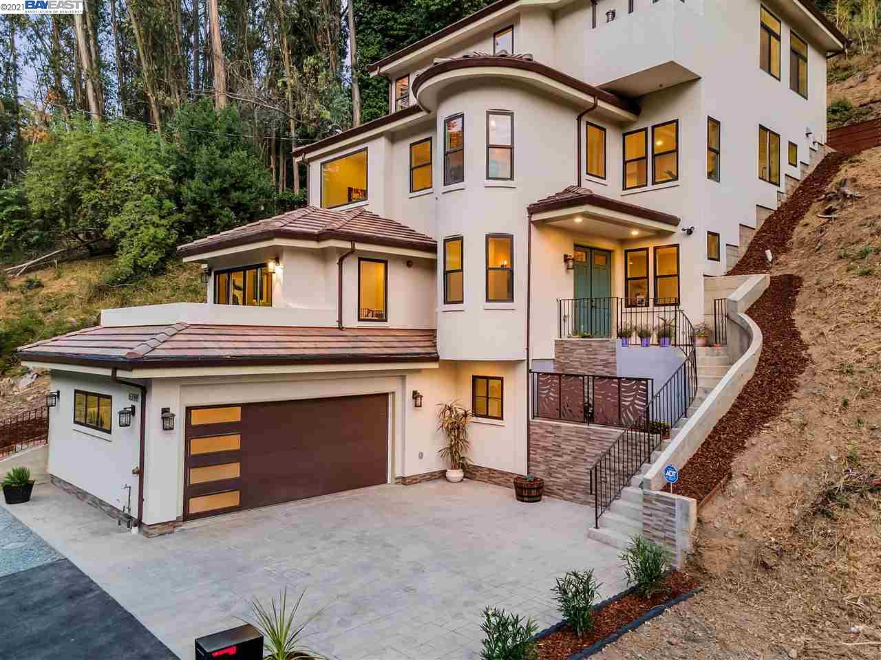 6388 Shepherd Canyon Road Oakland, CA 94611 - Photo 1 of 1 a front view of a house with a yard