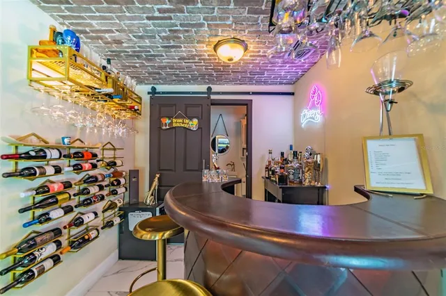 a bathroom with a granite countertop double vanity sink mirror and shower
