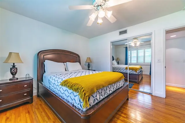 a bedroom with a large bed and a window