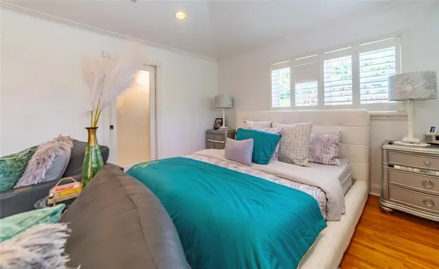 a bathroom with a granite countertop toilet sink and mirror