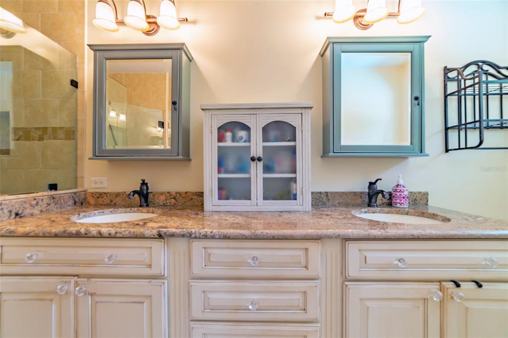 4201 West Dale Avenue Tampa, FL 33609 - Photo 37 of 77 a bathroom with sink granite and a mirror