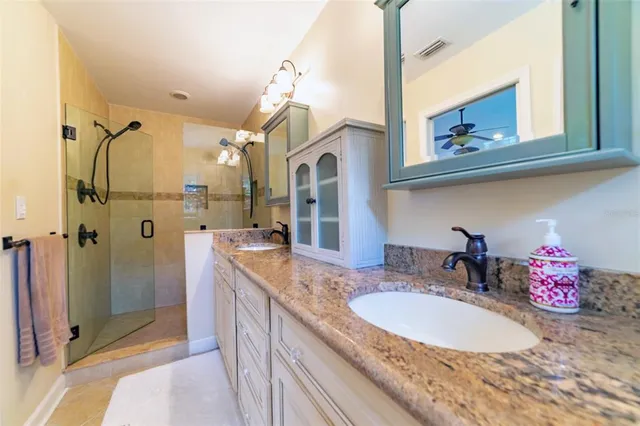 a front view of a house with swimming pool having outdoor seating