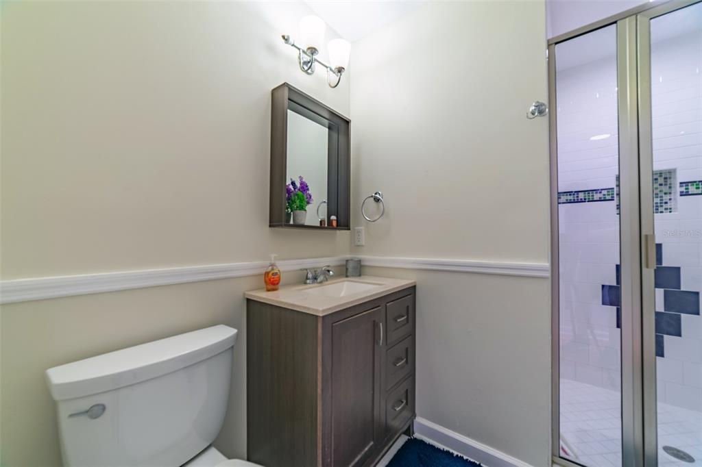 4201 West Dale Avenue Tampa, FL 33609 - Photo 41 of 77 a bathroom with a toilet sink and mirror