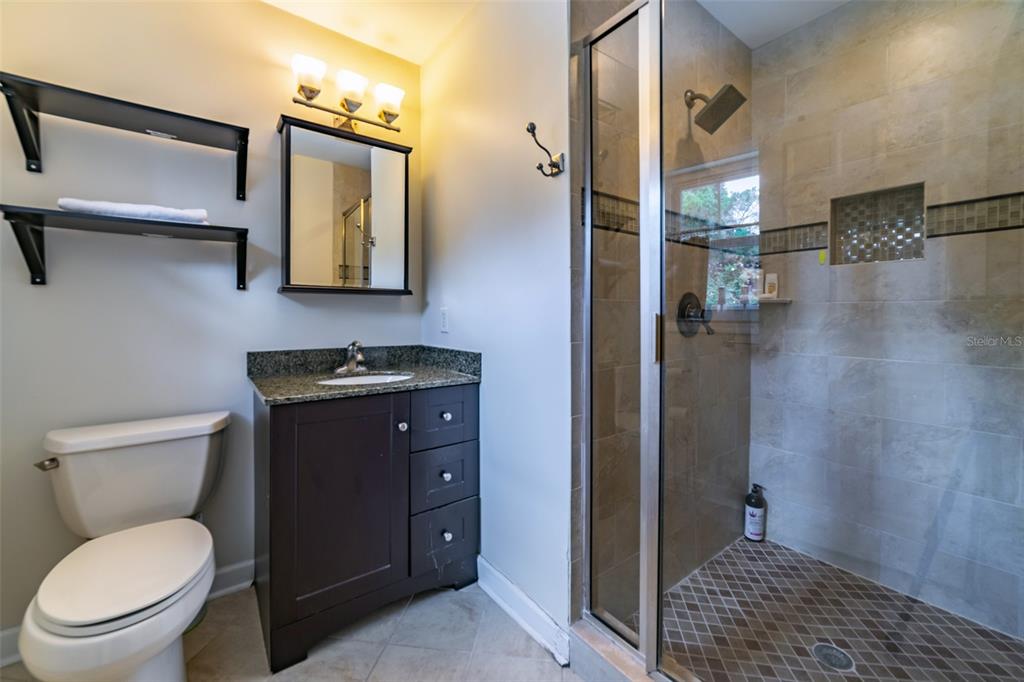 4201 West Dale Avenue Tampa, FL 33609 - Photo 46 of 77 a bathroom with a toilet a sink and shower