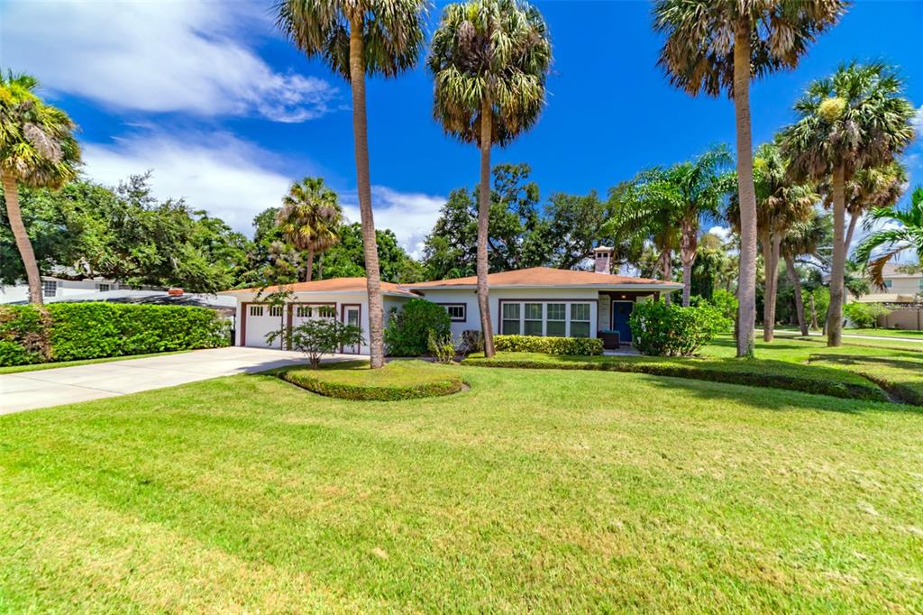 4201 West Dale Avenue Tampa, FL 33609 - Photo 59 of 77 a front view of a house with swimming pool having outdoor seating