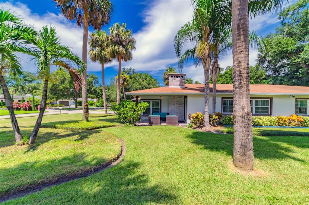 4201 West Dale Avenue Tampa, FL 33609 - Photo 60 of 77 a view of a house with swimming pool and a garden