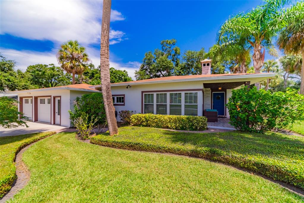 4201 West Dale Avenue Tampa, FL 33609 - Photo 69 of 77 a view of a house with a yard patio and a small yard
