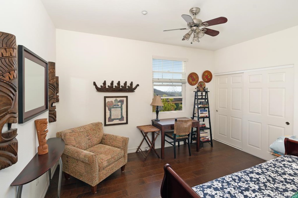 1445 Ranch Road Encinitas, CA 92024 - Photo 13 of 22 a living room with furniture a rug and a chandelier