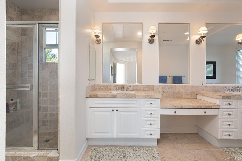 1445 Ranch Road Encinitas, CA 92024 - Photo 16 of 22 a bathroom with a granite countertop sink mirror and a