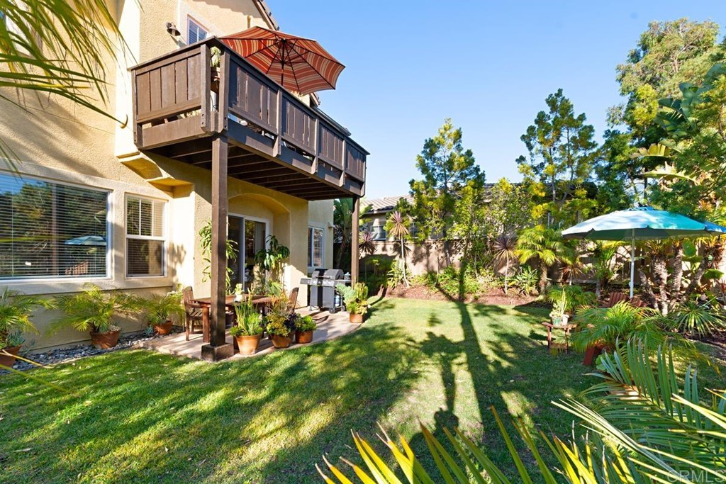 1445 Ranch Road Encinitas, CA 92024 - Photo 22 of 22 a view of a house with a yard and sitting area