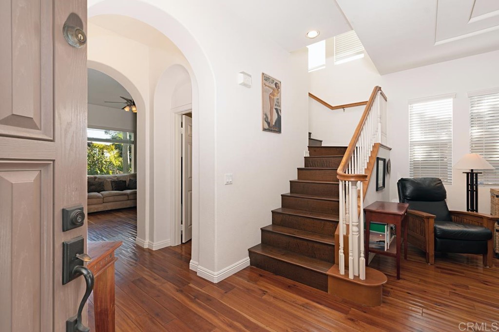 1445 Ranch Road Encinitas, CA 92024 - Photo 6 of 22 a view of entryway with wooden floor and stairs
