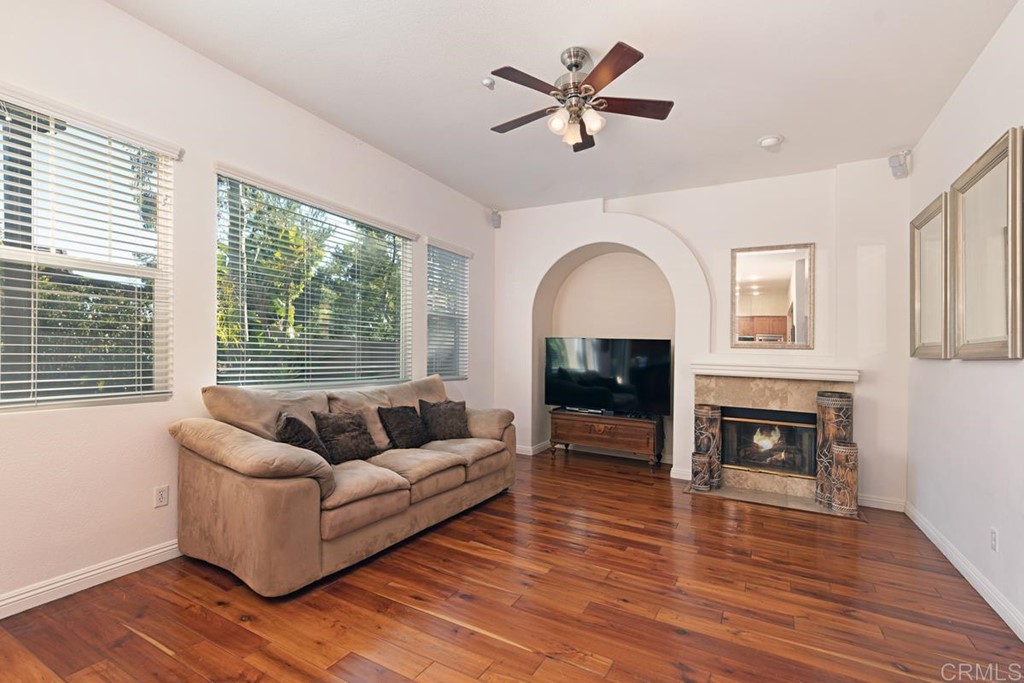1445 Ranch Road Encinitas, CA 92024 - Photo 9 of 22 a living room with furniture and a fireplace