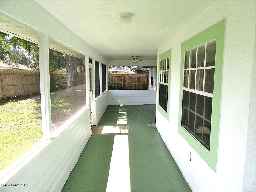 880 Evergreen Place Rockledge, FL 32955 - Photo 14 of 26 880Evergreen-BackPorchYard2