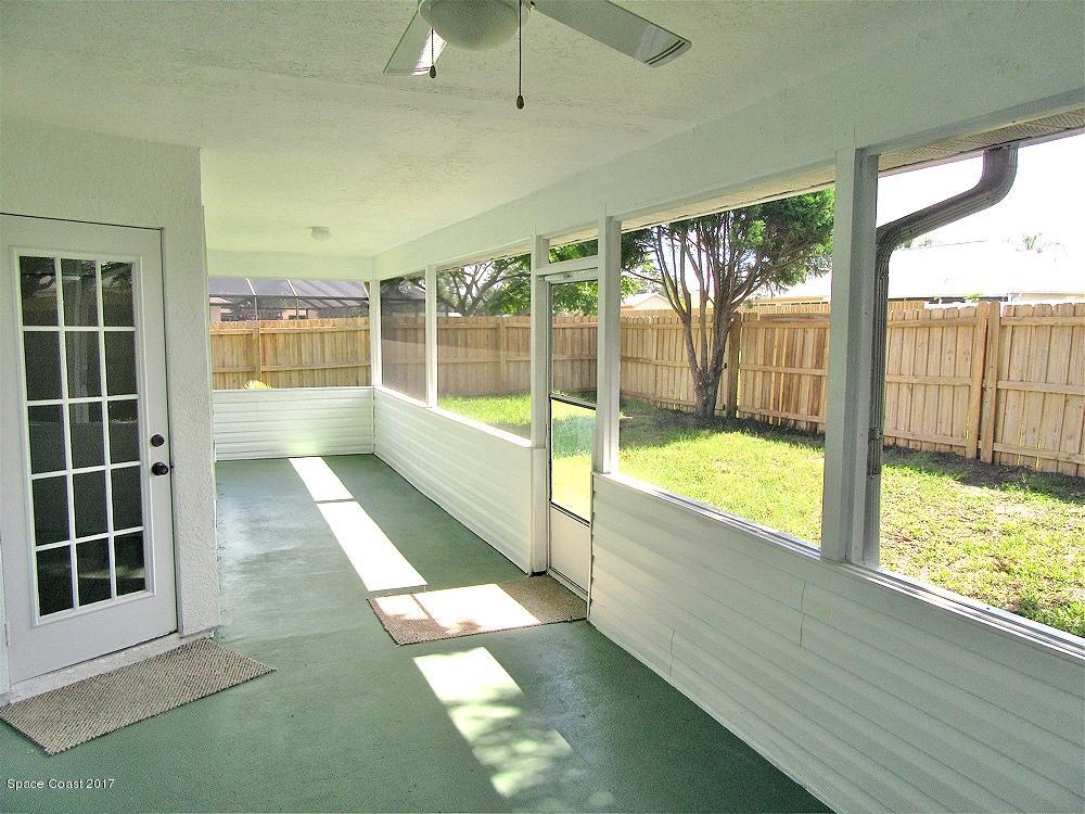 880 Evergreen Place Rockledge, FL 32955 - Photo 22 of 26 880Evergreen-BackPorchYard1