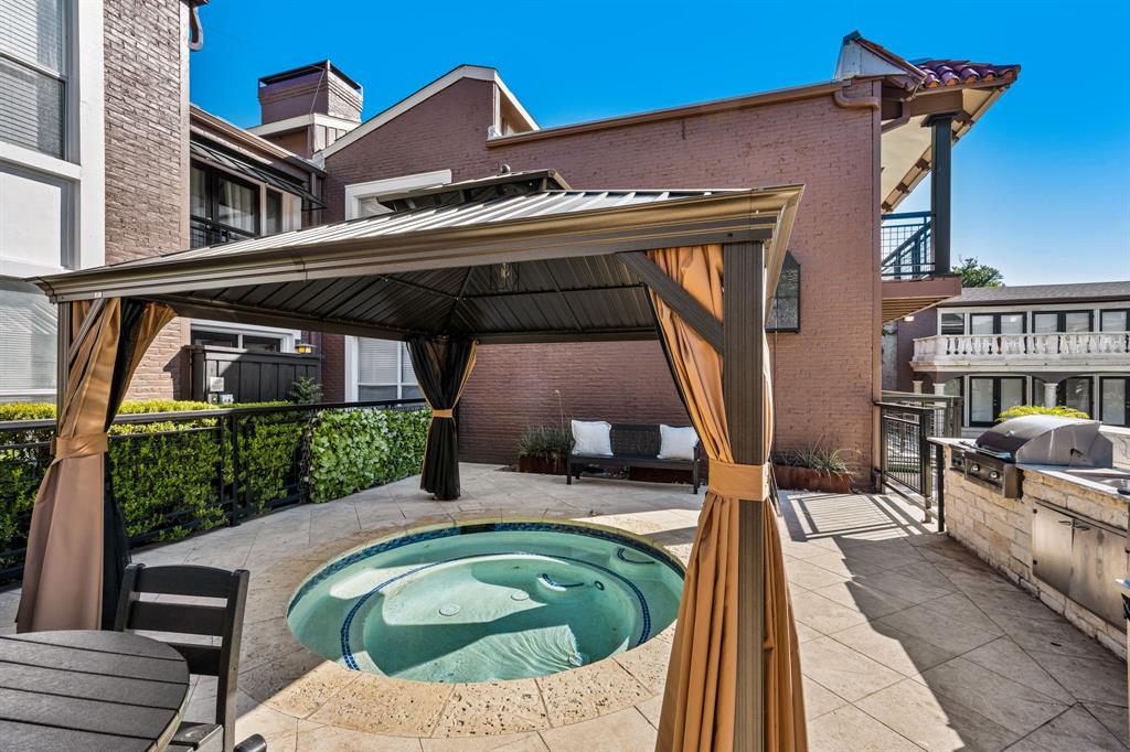 5934 Sandhurst Lane, Unit 109 Dallas, TX 75206 - Photo 13 of 14 a backyard of a house with outdoor seating